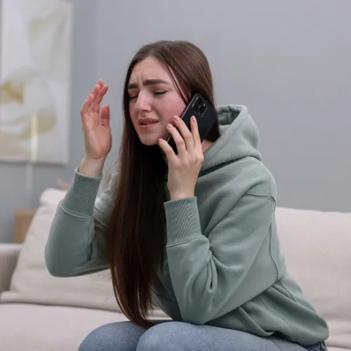 Person overwhelmed by a collection agency phone call